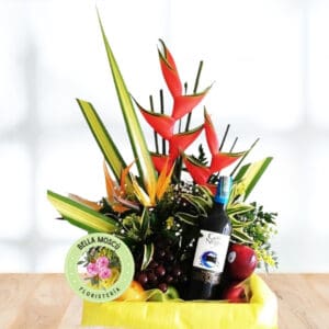 Arreglo Floral con Heliconias, aves del paraíso y vino